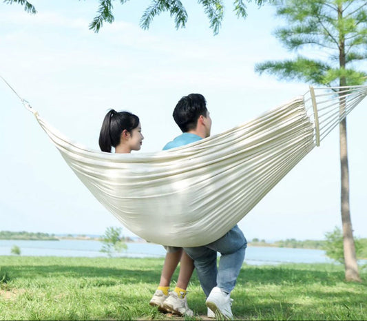 ECOTREK double reinforced anti-tip hammock in brown, showcasing sturdy construction and comfortable fabric for outdoor relaxation.