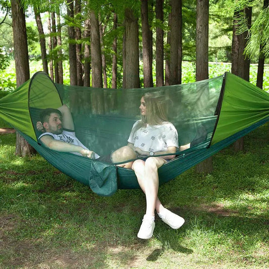 Light green ECOTREK portable mosquito hammock with net, quick-open design, suitable for outdoor camping and relaxation.