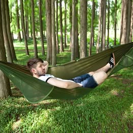 Light green ECOTREK portable mosquito hammock with quick-open design and integrated net, ideal for outdoor relaxation and protection.