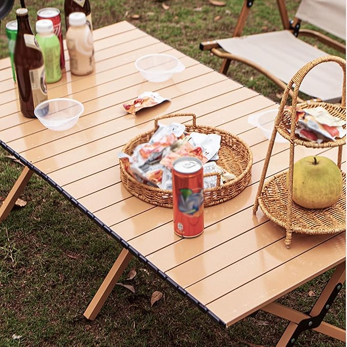Black ECOTREK portable outdoor folding table with egg roll style design, 120cm length, suitable for camping and outdoor activities.