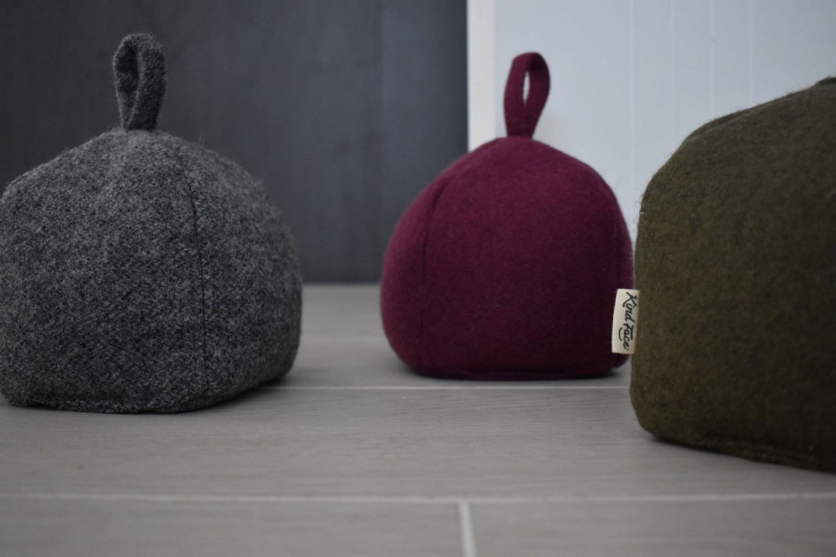 Felted New Zealand wool door stop by Do Not Disturb Sleep Company, showcasing a soft, handcrafted door accessory on a wooden floor.