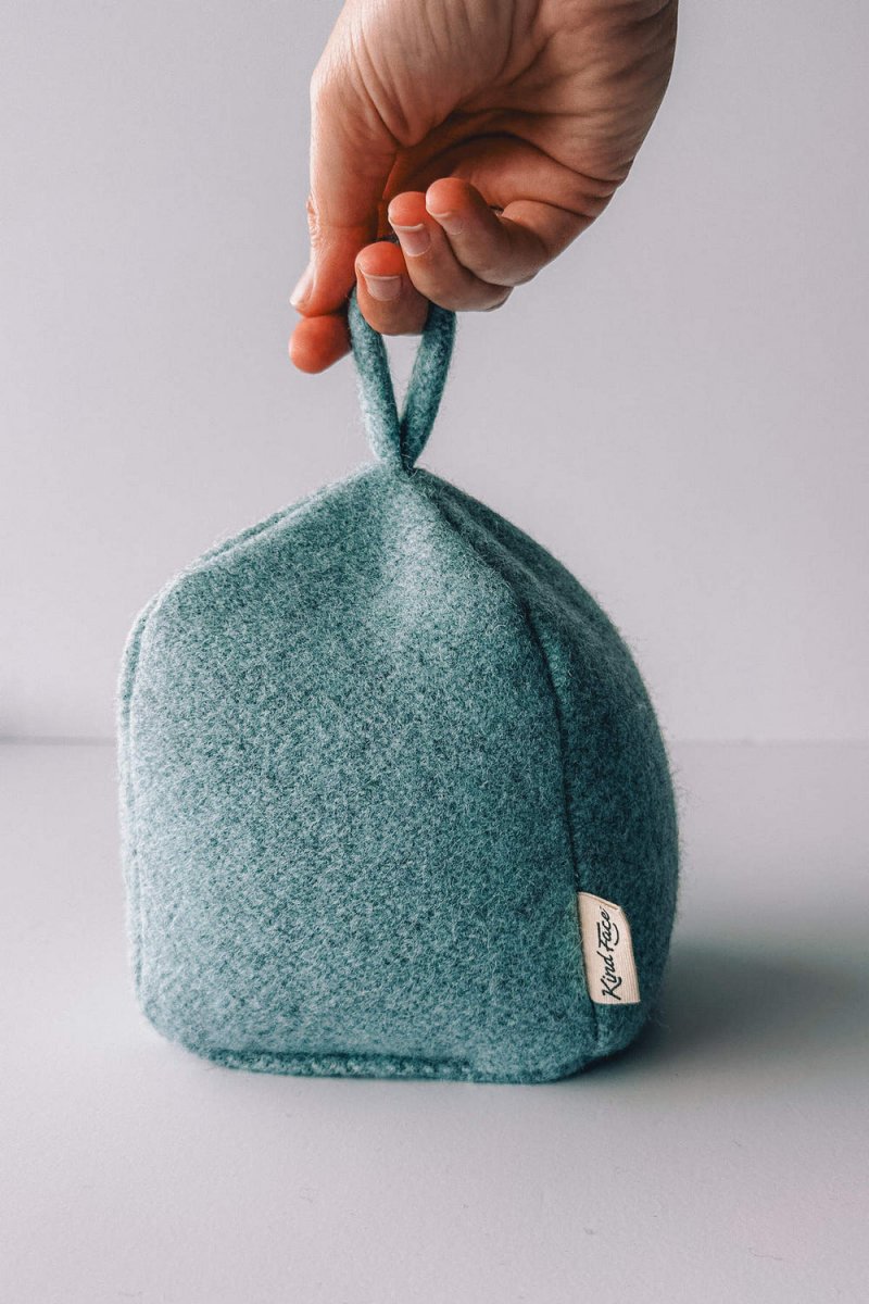 Felted New Zealand wool door stop by Do Not Disturb Sleep Company, featuring a soft, textured design for holding doors open.