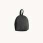 Felted NZ wool door stop from Do Not Disturb Sleep Company, soft and textured with a rounded shape for door stability.