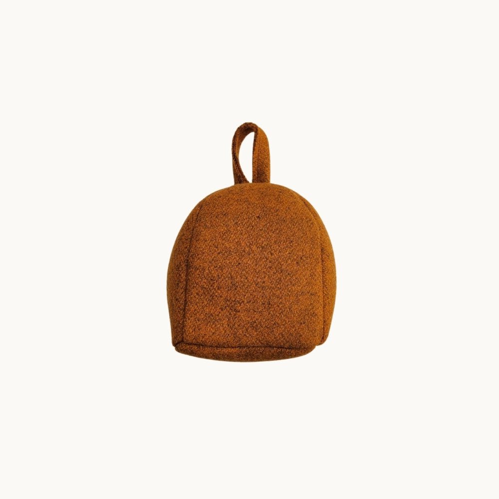 Felted NZ wool door stop from Do Not Disturb Sleep Company, crafted with colorful, textured felted wool for sturdy door support.