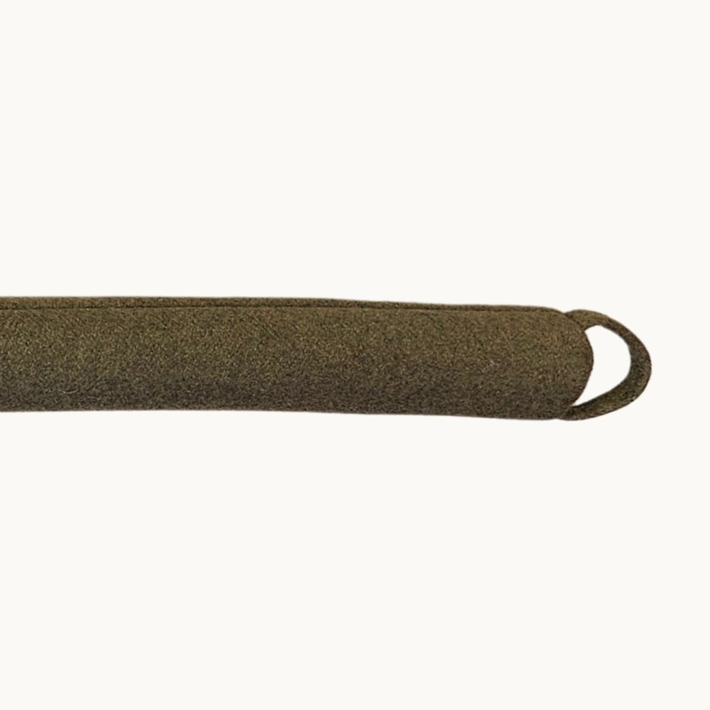 Felted NZ wool draught stopper by Do Not Disturb Sleep Company blocking a door or window to prevent drafts.