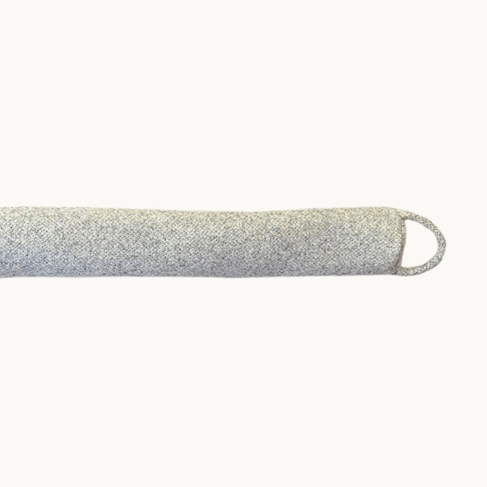 Felted New Zealand wool draught stopper from Do Not Disturb Sleep Company, designed to block drafts under doors or windows.