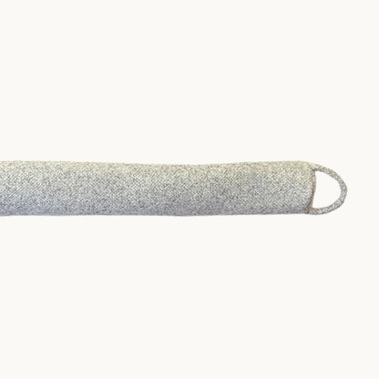 Felted New Zealand wool draught stopper from Do Not Disturb Sleep Company, designed to block drafts under doors or windows.