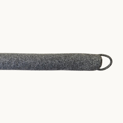 Felted New Zealand wool draught stopper by Do Not Disturb Sleep Company to seal door or window gaps and prevent drafts.
