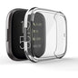 Clear protective case for Fitbit Versa 4 watch, made by That Watch Shop, shown fitted on the device with transparent coverage.