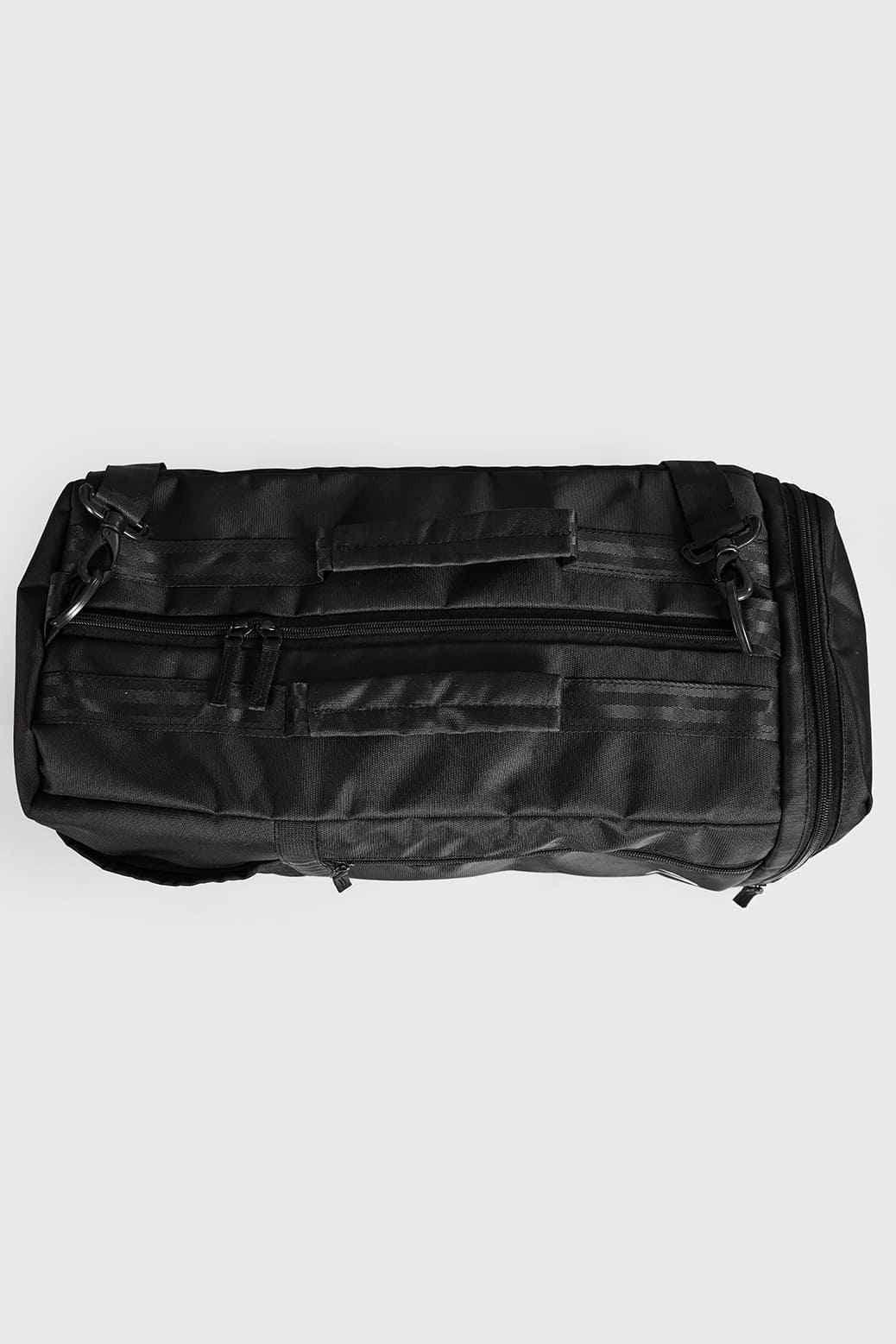 Black Fuaark Nz Elite Duffle Bag with sturdy handles and spacious main compartment for travel or gym use.