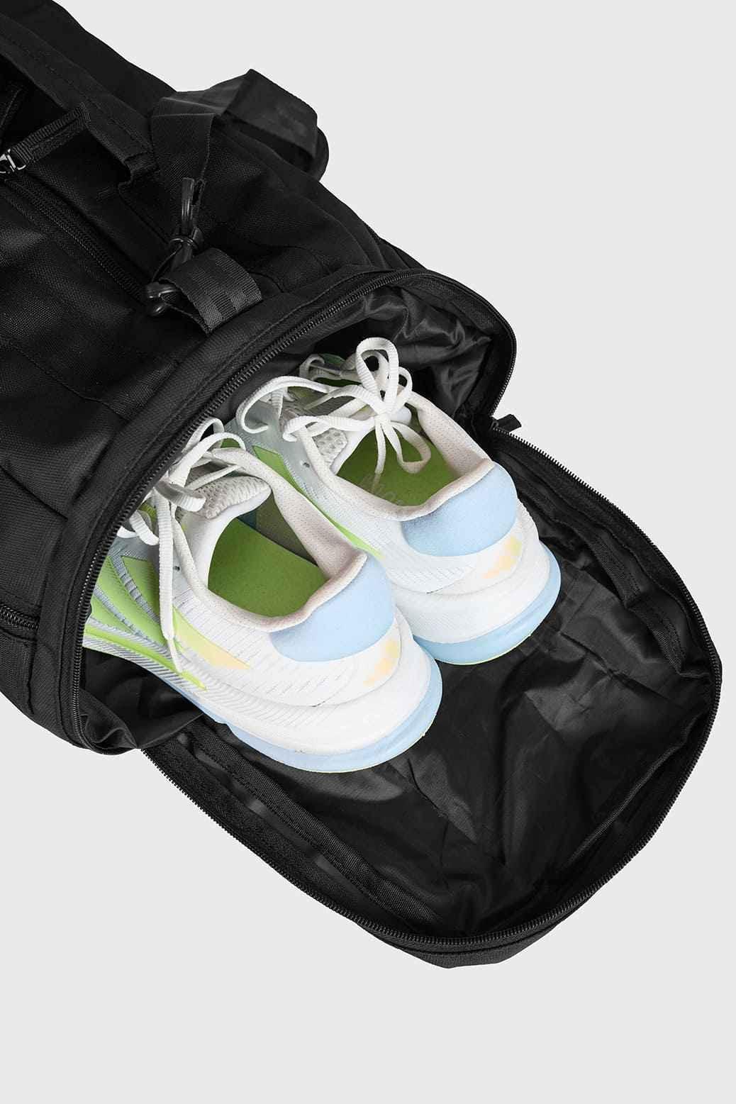 Black Fuaark Nz Elite Duffle Bag with sturdy handles and spacious main compartment, ideal for travel and gym use.