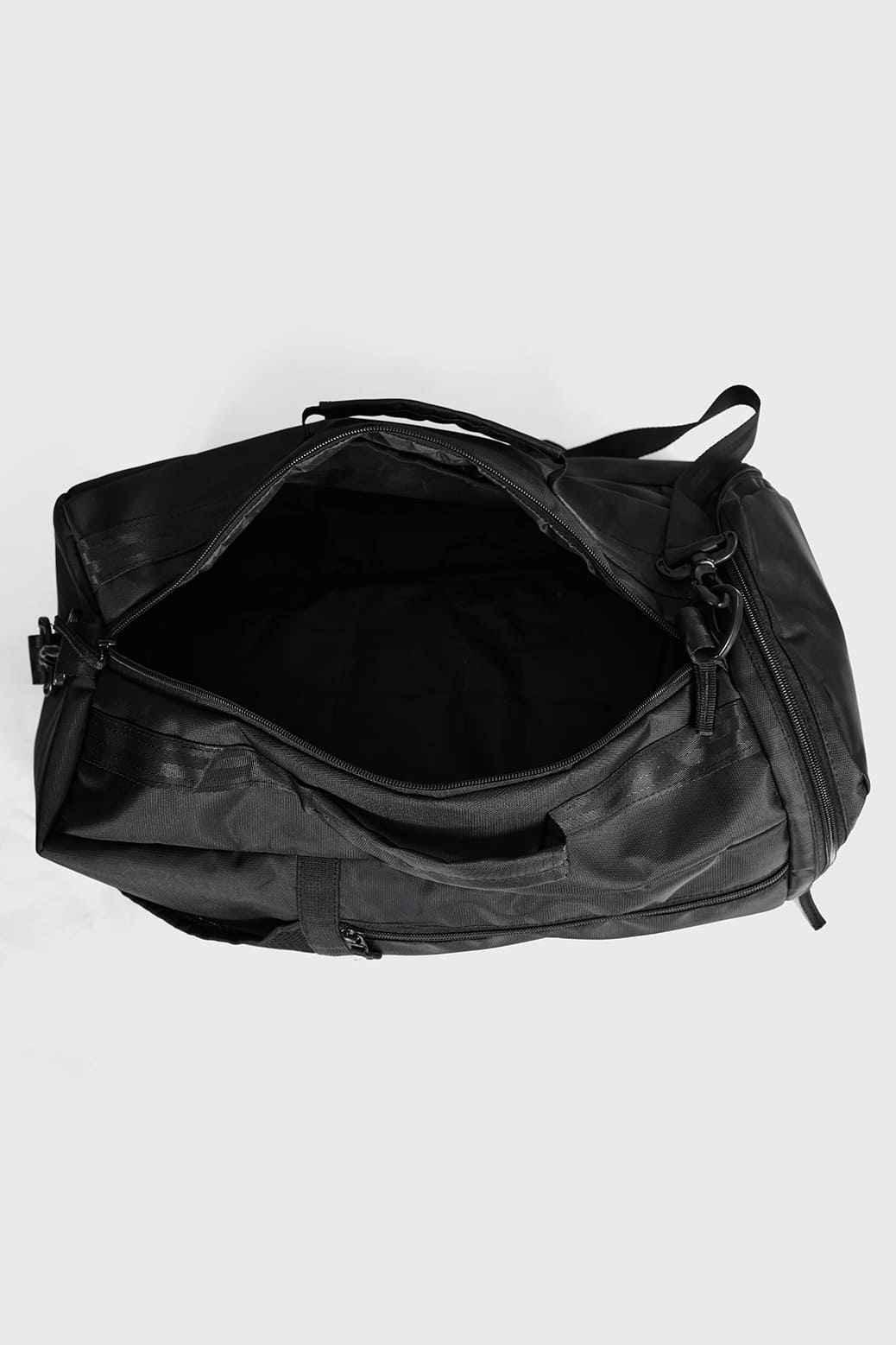 Black Fuaark Nz Elite Duffle Bag with sturdy handles and spacious main compartment for travel and gym use.