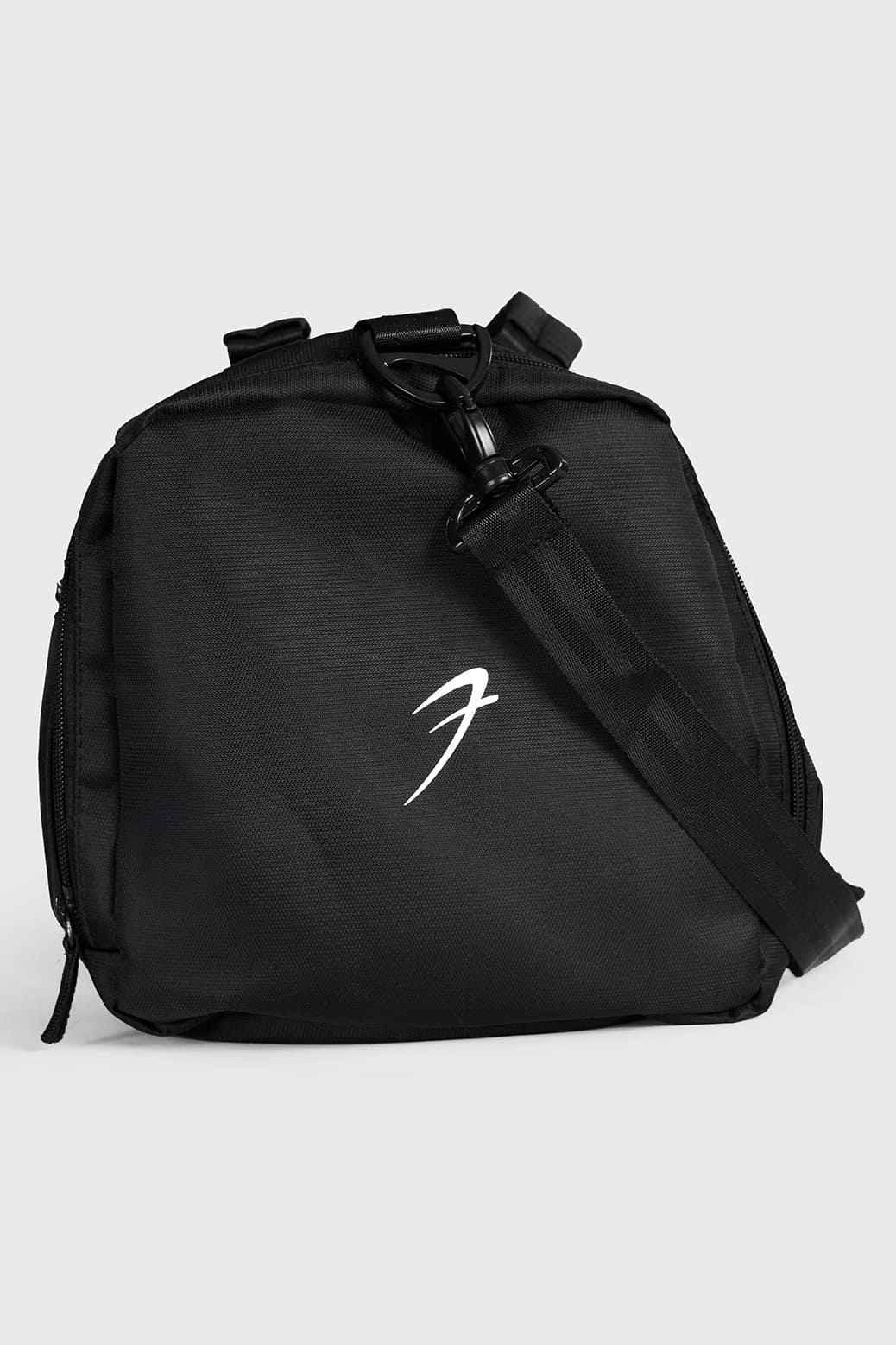 Black Elite Duffle Bag by Fuaark NZ featuring sturdy handles and spacious main compartment for travel and gym use.