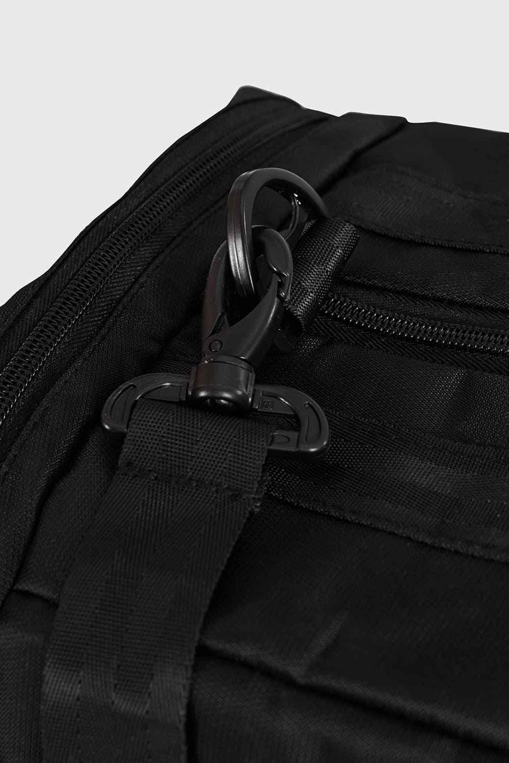 Black Elite Duffle Bag by Fuaark Nz with sturdy handles and spacious main compartment for travel and gym use.
