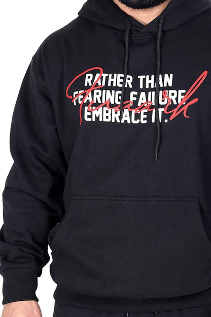 Oversized black hoodie by Fuaark Nz with frosted design, featuring a relaxed fit and soft fabric in a close-up image.