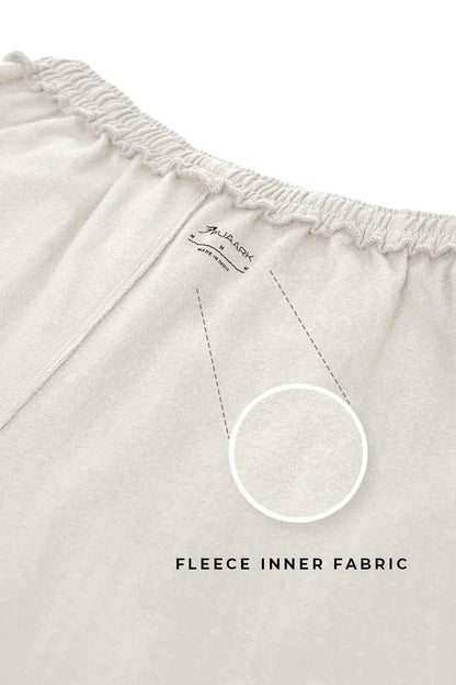 Beige laidback relaxed joggers by Fuaark NZ with a comfortable fit and casual style, shown on a model.