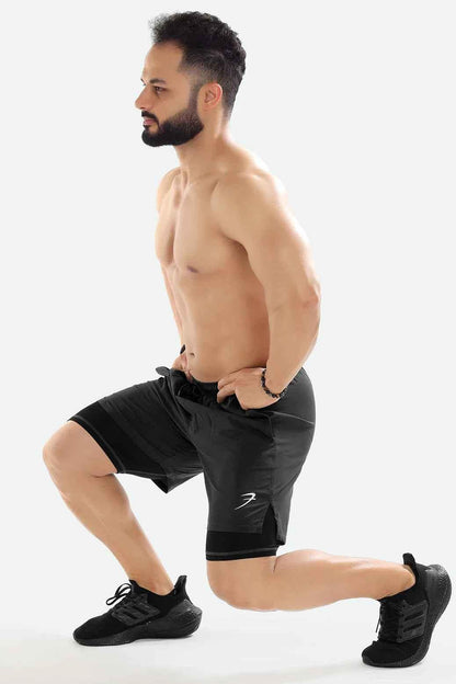 Dark grey 2-in-1 compression shorts by Fuaark NZ with layered design, suitable for athletic and active wear.