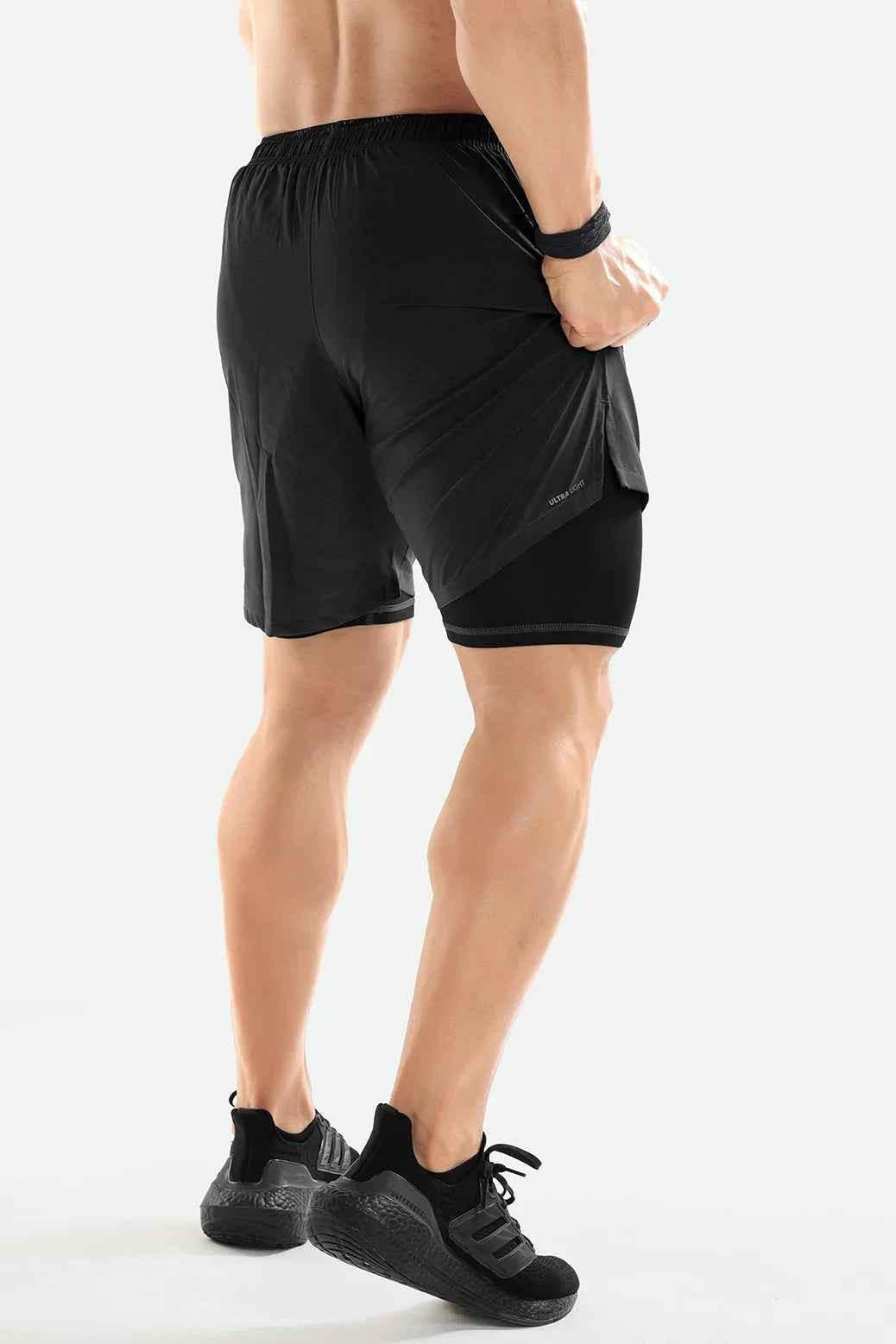 Dark grey 2-in-1 compression shorts by Fuaark NZ, featuring a sleek design and comfortable fit for athletic wear.