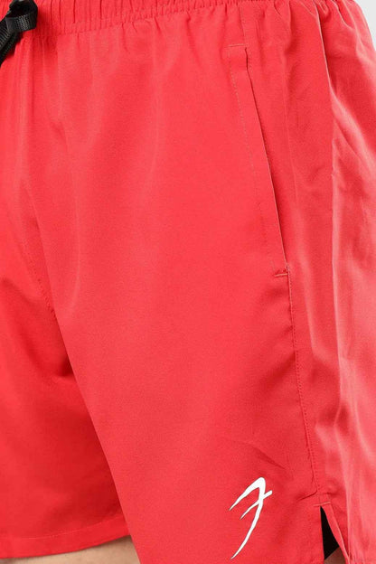 Red Fuaark Nz 2-in-1 compression shorts with sleek design and stretchy fabric for comfortable active wear.