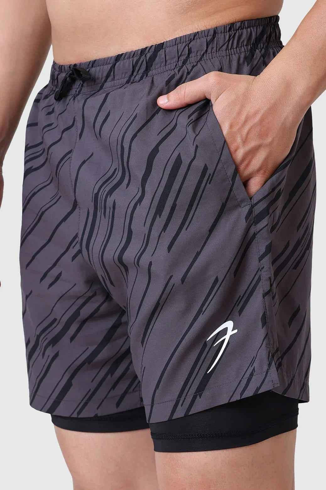 Fuaark Nz 2-in-1 printed compression shorts in graphite with colorful graphic design, designed for active wear and comfort.