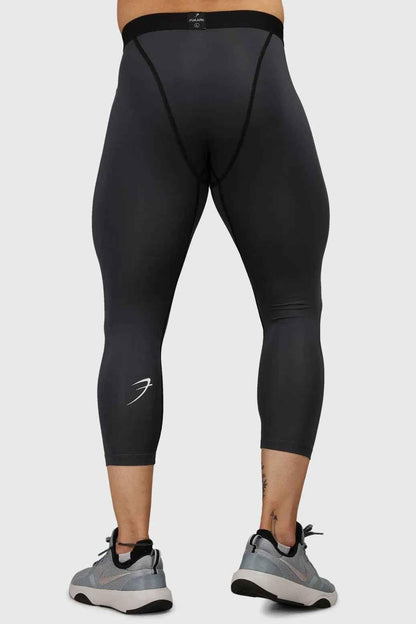 Dark grey Fuaark Nz compression tights, close-up of stretchy fabric and fitted design for athletic support and comfort.