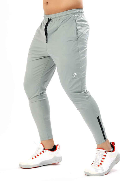 Light grey nylon Supreme track from Fuaark Nz, showcasing the sleek design and fabric texture of this athletic track.