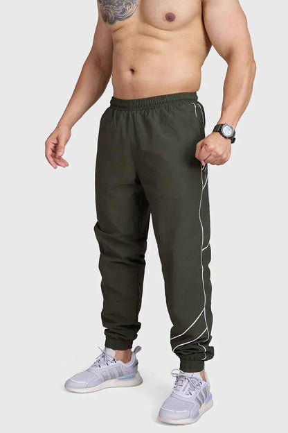 Fuaark Nz Sprint Joggers Army track pants in olive green, featuring a comfortable fit and sporty design for active wear.