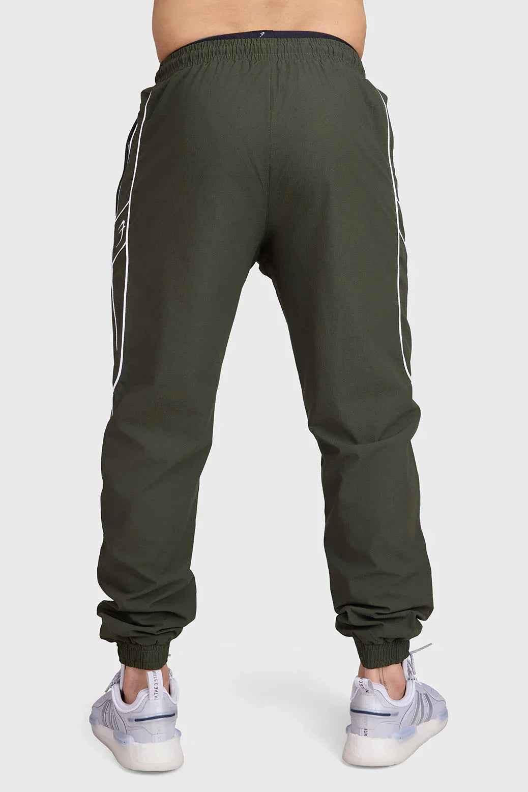 Fuaark Nz Sprint Joggers Army green track pants with elastic waistband and tapered fit, suitable for athletic or casual wear.