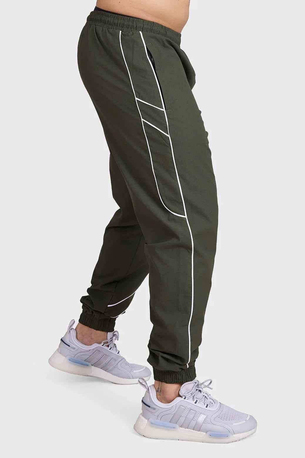 Fuaark Nz Sprint Joggers Army green track pants with elastic waistband and tapered fit, designed for active wear and comfort.