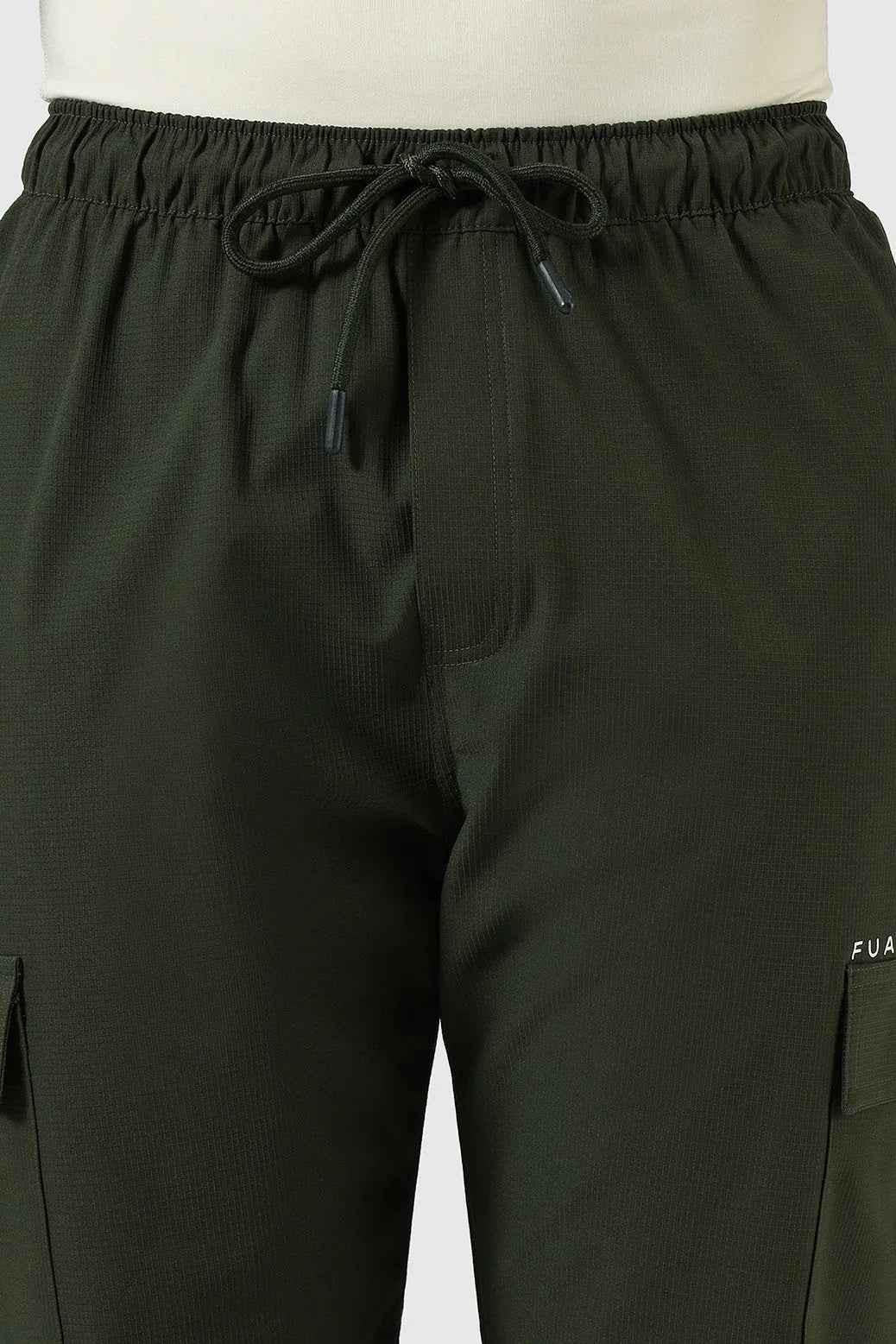 Olive green Fuaark Nz Vitality Straight Track Pants laid flat, showcasing their slim fit and casual design.