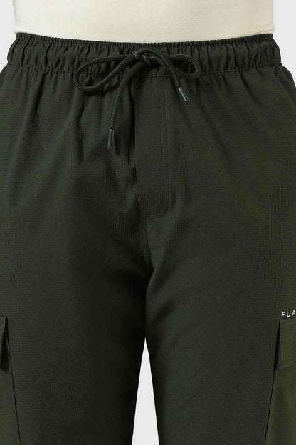 Olive green Fuaark Nz Vitality Straight Track Pants laid flat, showcasing their slim fit and casual design.