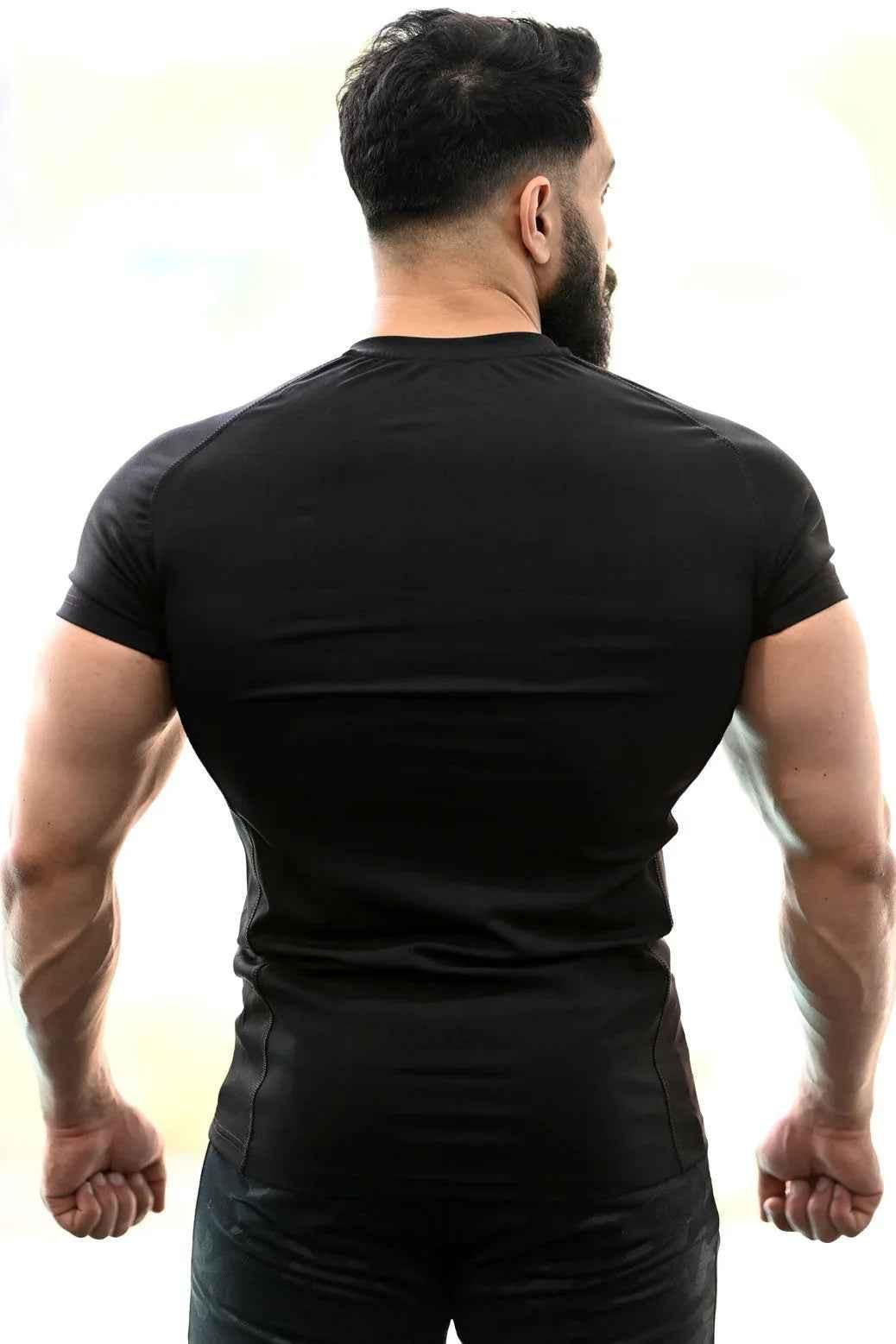 Black Performance T-shirt from Fuaark Nz featuring a comfortable fit and sleek design, ideal for active wear and casual outings.