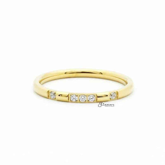 Gold stainless steel band ring with five CZ inlays, featuring a sleek design by Glitters.