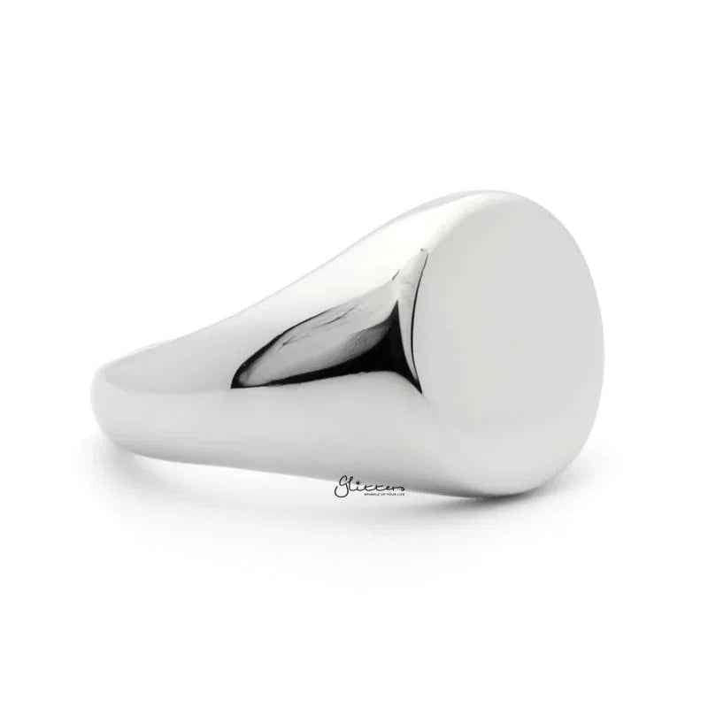 Silver stainless steel round signet ring by Glitters, showcasing a smooth, polished surface and bold design.