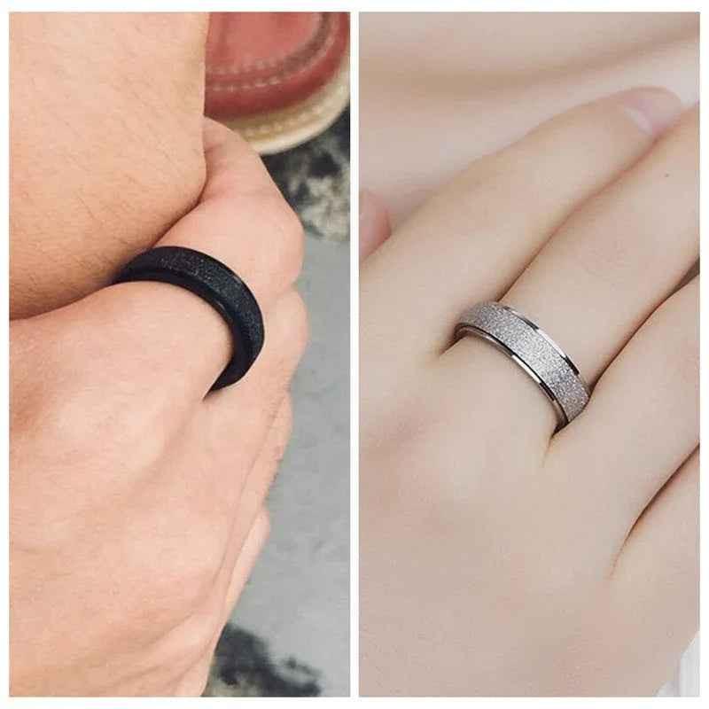 Gold stainless steel band ring with a sandblasted finish, designed by Glitters, showcasing a sleek, textured surface.