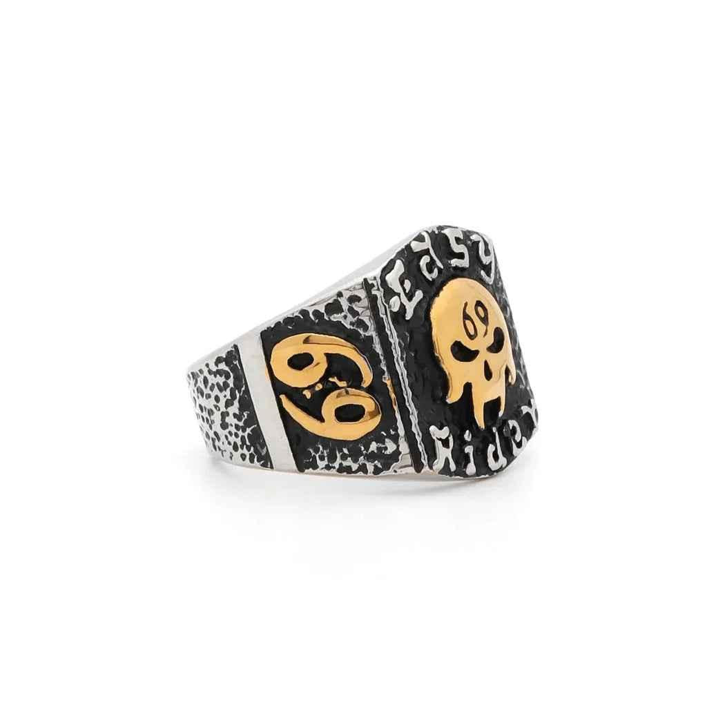 Stainless steel skull ring from Glitters with a detailed skull design, smooth band, and polished finish.