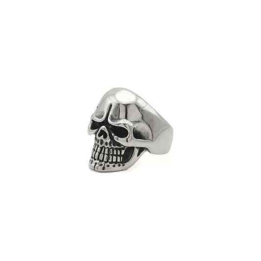 Stainless steel skull ring with tribal pattern from Glitters, showcasing detailed design and polished finish.