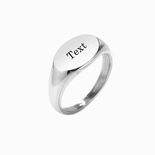 Personalised silver stainless steel oval signet ring featuring a smooth, polished surface and engraved design for a stylish look