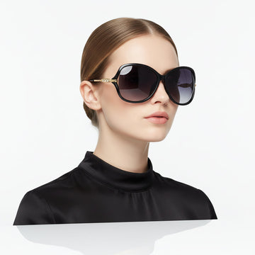 Black dealonlinenz sunglasses with polarized lenses and rhinestone detail, stylish sun eyewear with decorative embellishments.