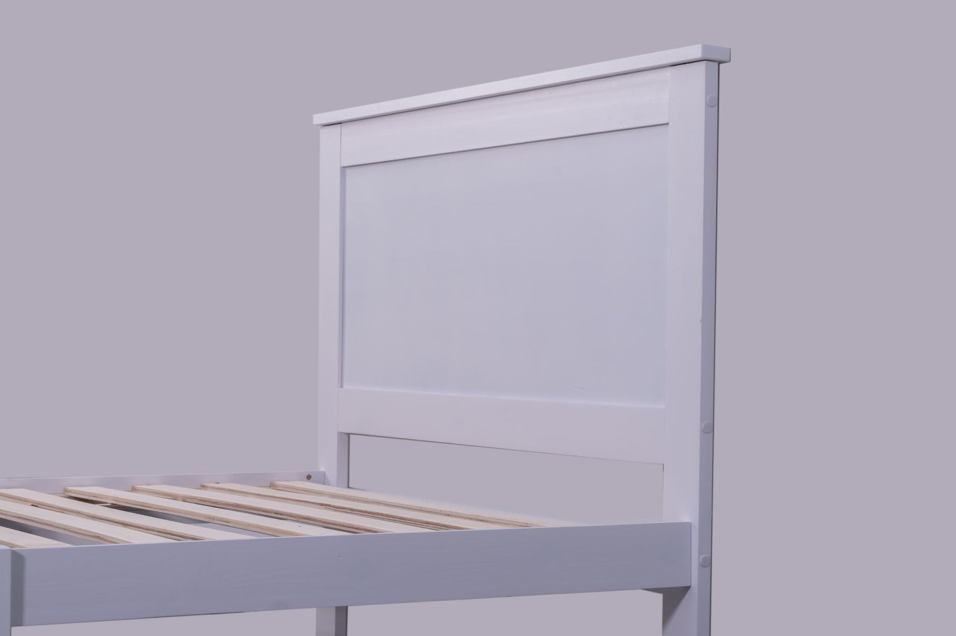 White single solid pine bed frame from Sue-e Furniture's Metro collection, featuring a sleek and sturdy design.