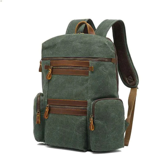 Army green waxed canvas waterproof travel laptop backpack by Mead's Supply & Equipment Outfitters, with soft cotton lining, 20-35L capacity.