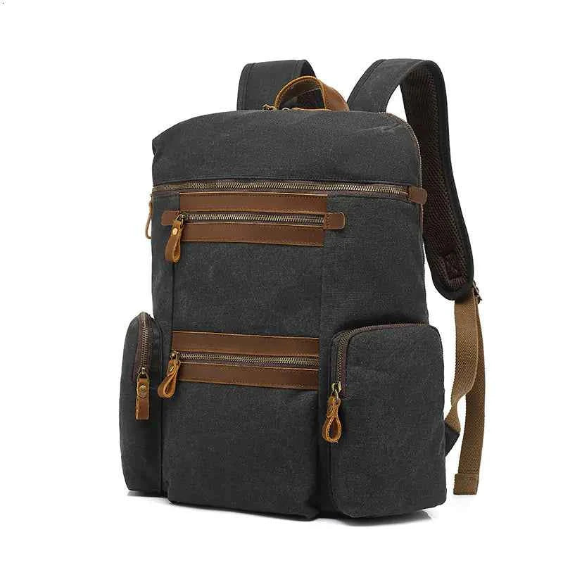 Army green Mead's Supply waterproof waxed canvas travel backpack with soft cotton lining, 20-35L computer bag for laptops.