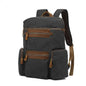 Army green Mead's Supply waterproof waxed canvas travel backpack with soft cotton lining, 20-35L computer bag for laptops.
