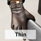 Black leather gloves with velvet lining from Mead's Supply & Equipment Outfitters, showing close-up of the gloves' texture and lining