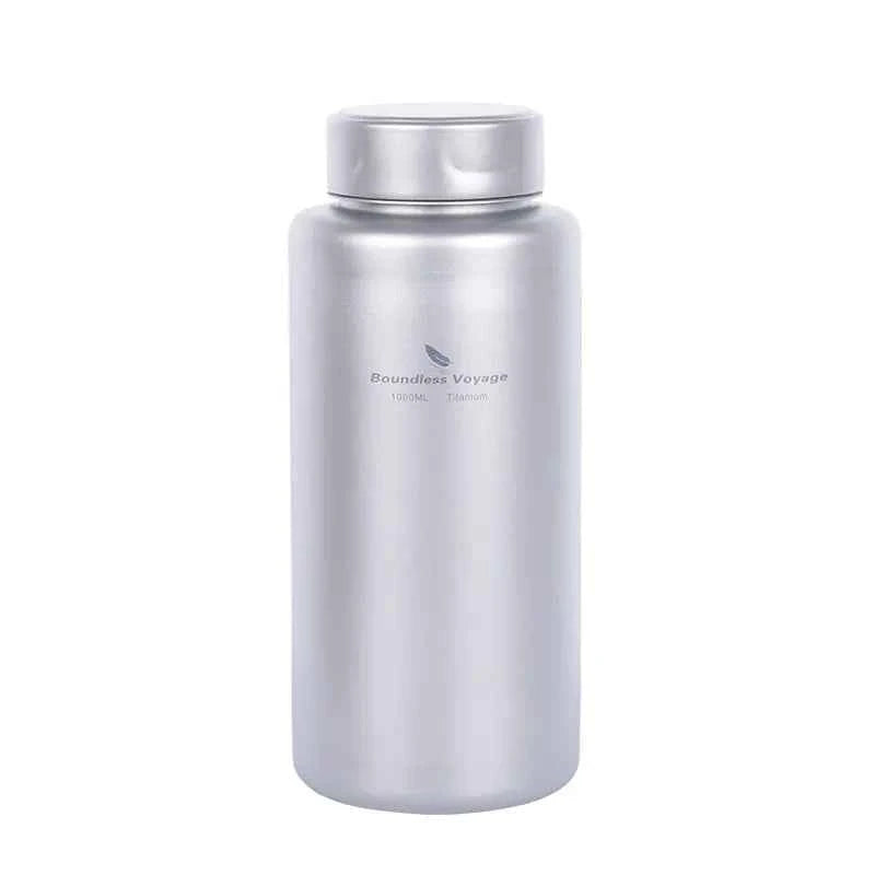 Silver titanium outdoor water bottle by Mead's Supply, 1000ml lightweight camping flask, leak-proof hiking drinkware.