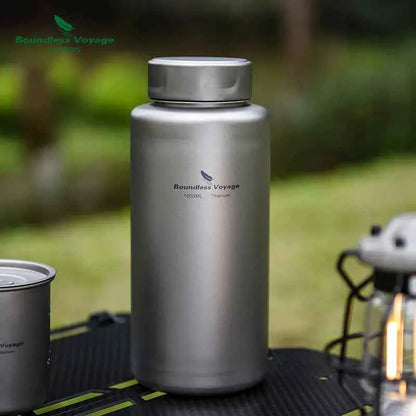 Titanium outdoor water bottle by Mead's Supply, 1000ml lightweight camping flask, leak-proof hiking drinkware in silver.