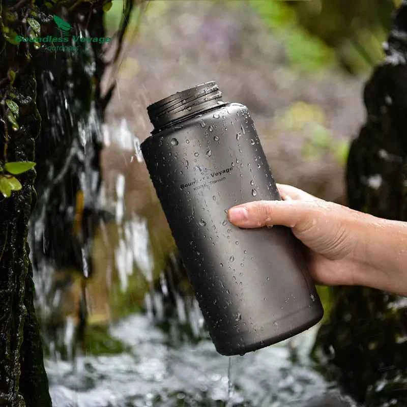 Silver titanium outdoor water bottle, 1000ml, lightweight camping flask, leak-proof hiking bottle from Mead's Supply & Equipment.