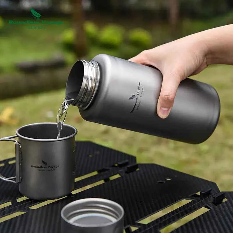 Silver titanium outdoor water bottle, 1000ml, lightweight camping flask with leak-proof design, ideal for hiking and outdoor activities.