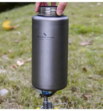Silver titanium outdoor water bottle by Mead's Supply, 1000ml leak-proof camping flask for hiking and outdoor activities.