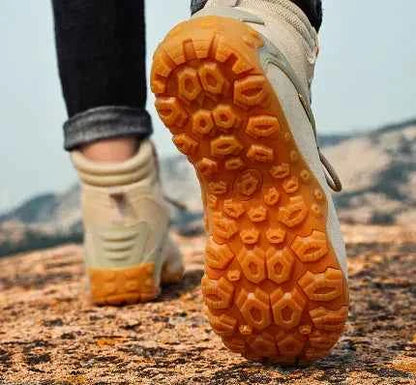 Women's waterproof hiking boots by Mead's Supply & Equipment Outfitters, lightweight climbing shoes in black, outdoor footwear.